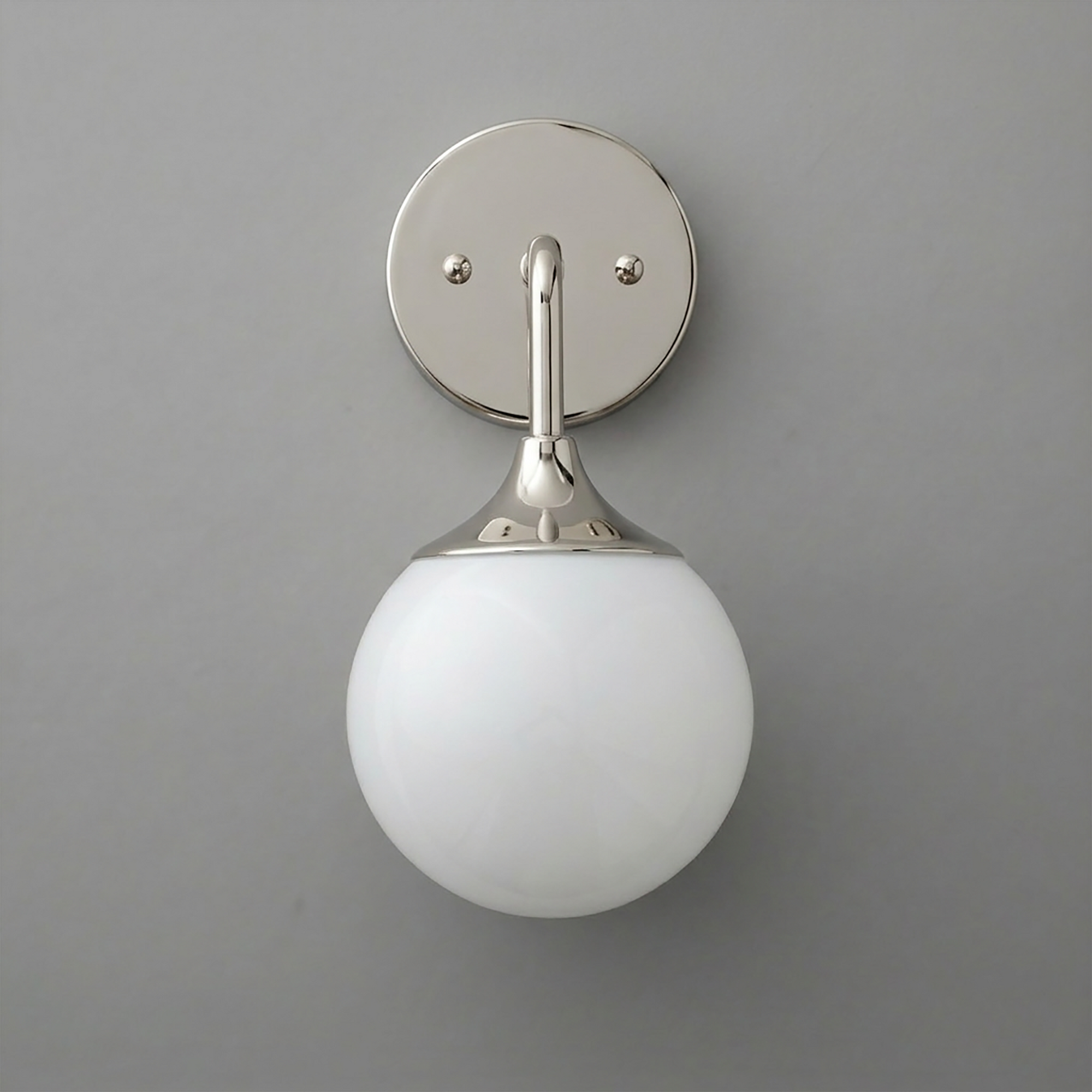 Polished nickel wall sconce with a round white glass globe shade and circular mounting plate. - SCONCE MODEL NO. 1752
