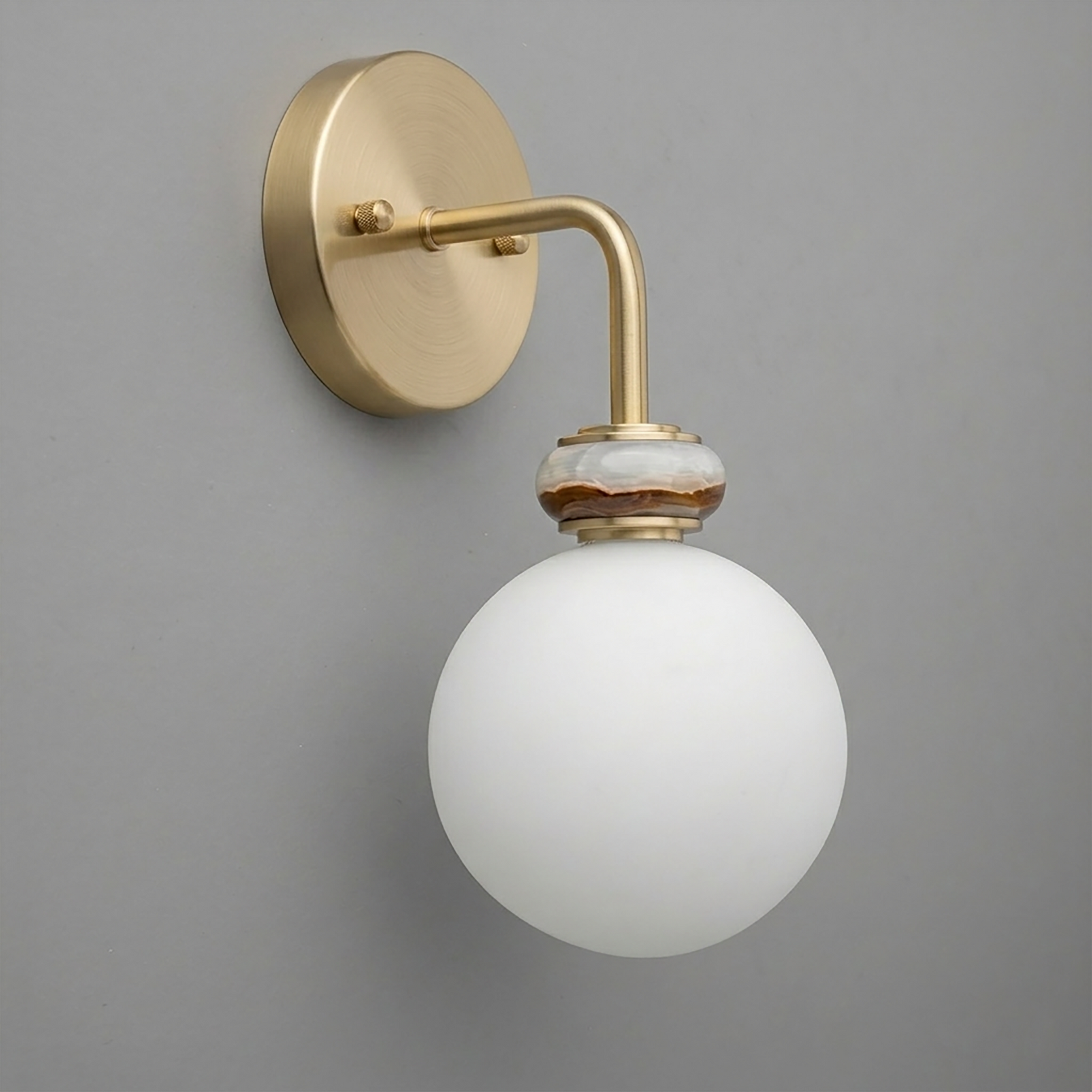 Wall sconce with matte gold metal arm and round white frosted glass globe shade. - SCONCE MODEL NO. 5449