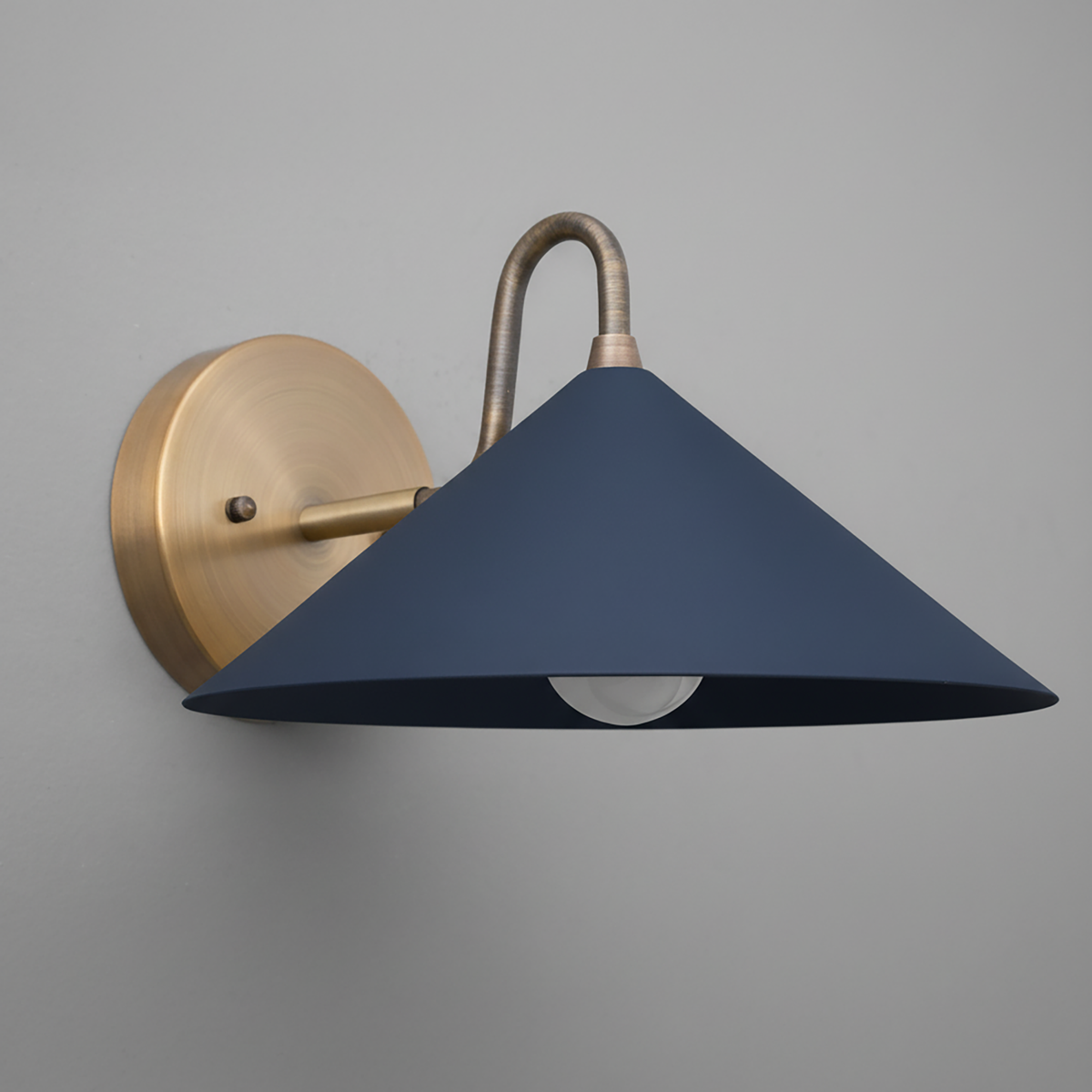 Matte coal blue conical metal shade with antique brass curved arm wall sconce. - SCONCE MODEL NO. 6528