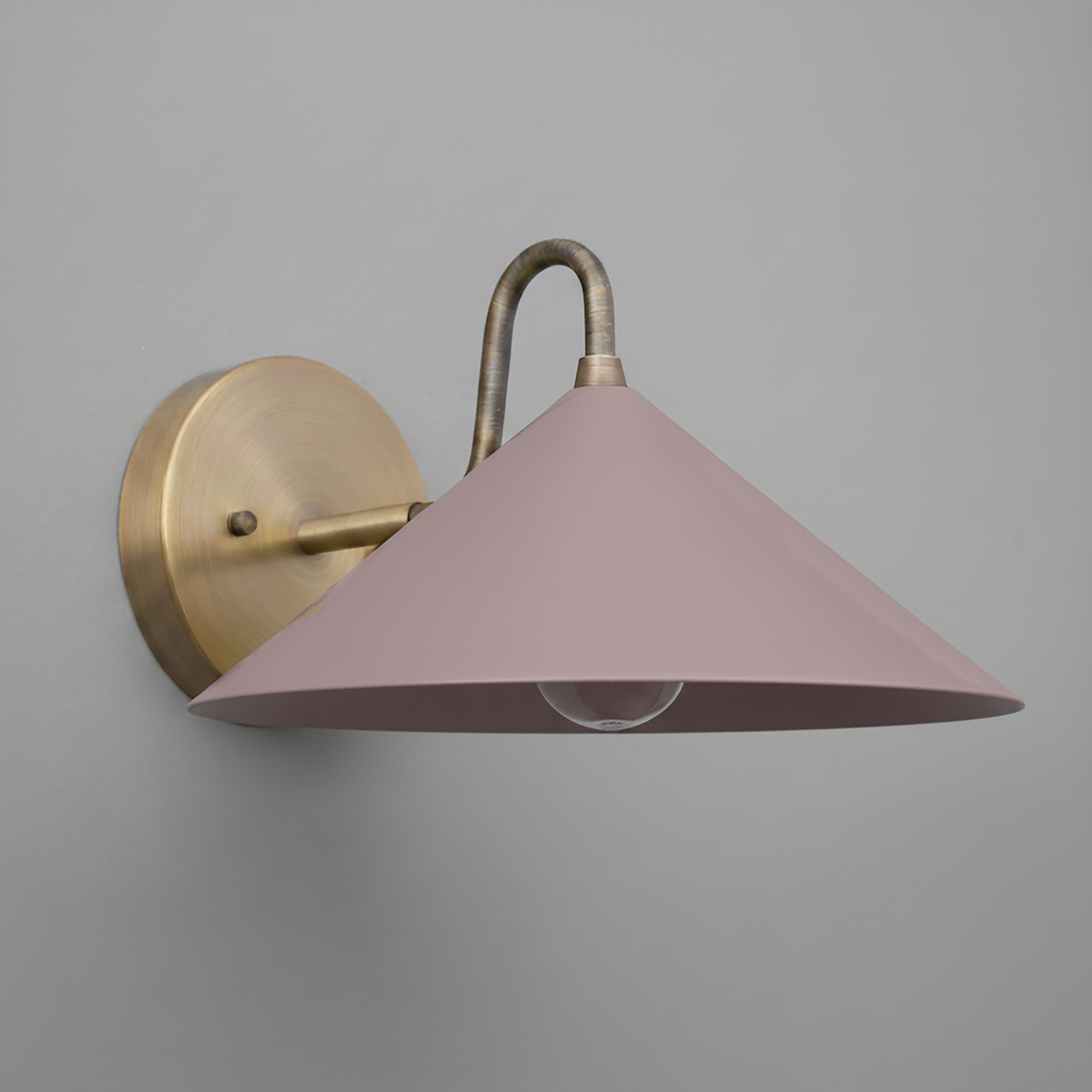 Antique brass wall sconce with a mauve conical metal shade and exposed bulb design. - SCONCE MODEL NO. 6528