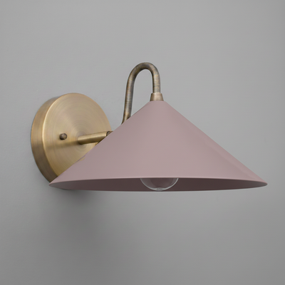 Antique brass wall sconce with a mauve conical metal shade and exposed bulb design. - SCONCE MODEL NO. 6528