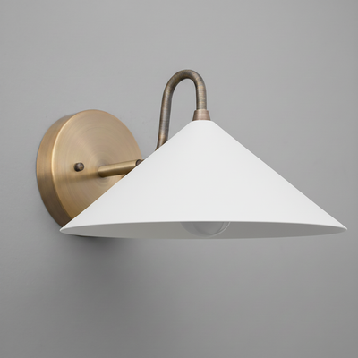 Wall sconce with antique brass mount and curved arm, white conical metal shade. - SCONCE MODEL NO. 6528