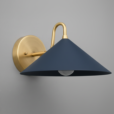 Antique brass sconce with a wide coal blue conical metal shade and exposed bulb against gray wall. - SCONCE MODEL NO. 6528