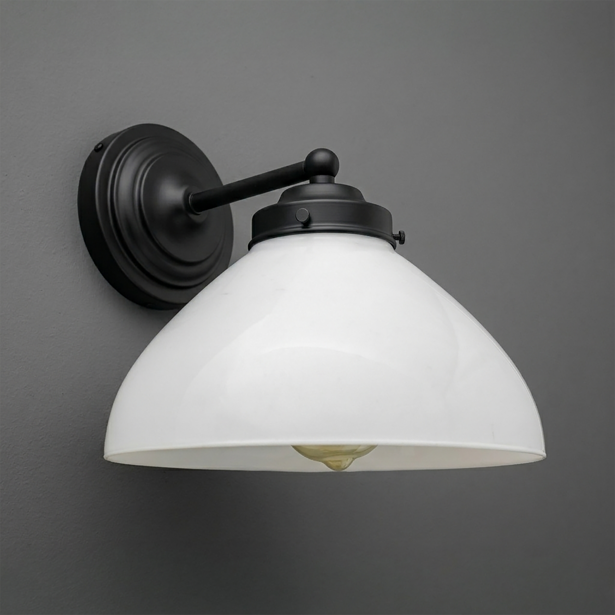 Black metal wall sconce with a matte finish and a white glass dome shade. - SCONCE MODEL NO. 9835