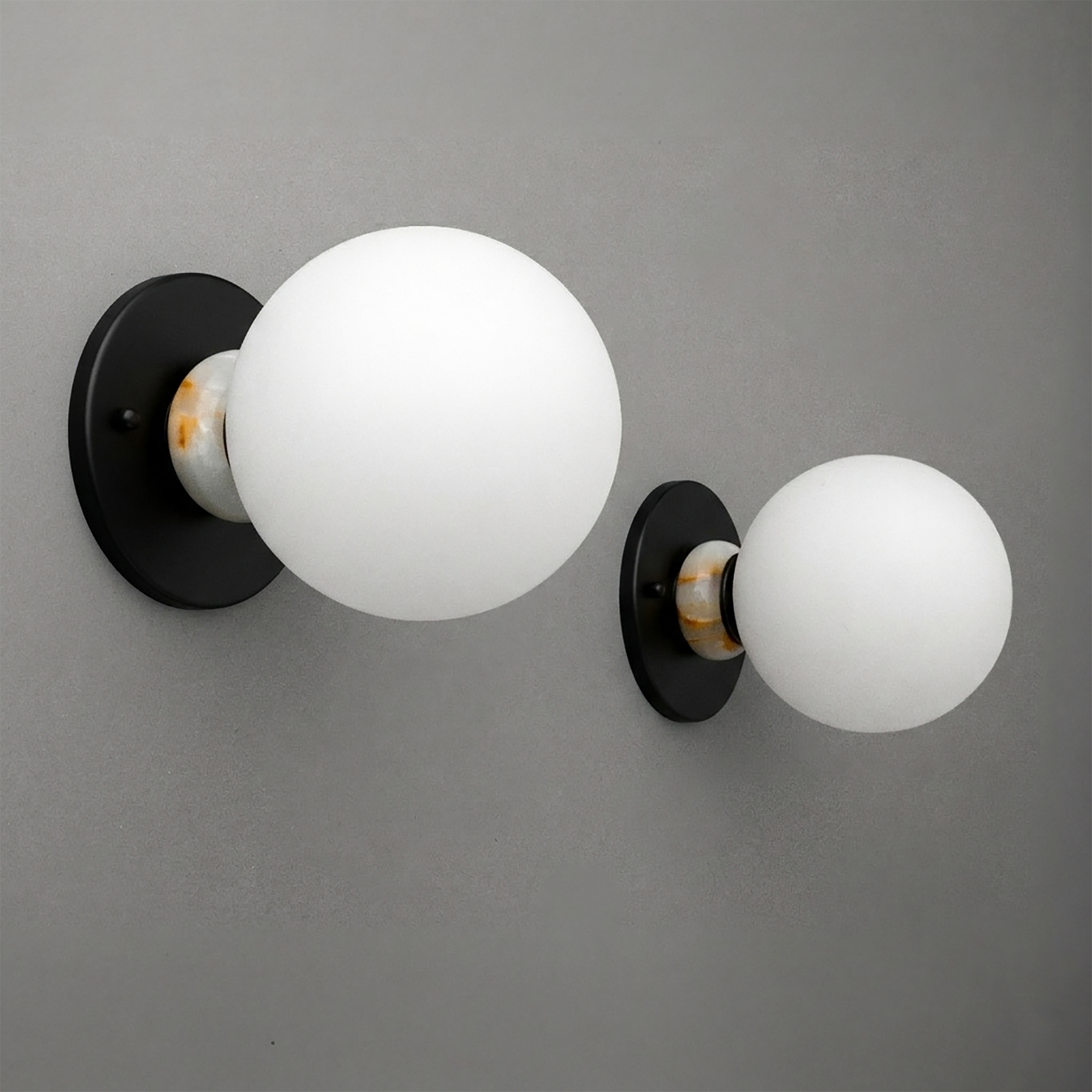 Minimalist wall sconce with matte black circular base and frosted white glass globe shade. - SCONCE MODEL NO. 1246