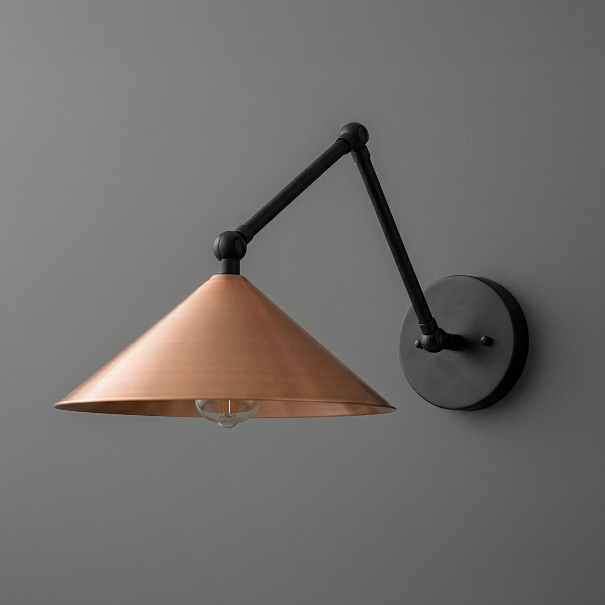 Adjustable black metal arm wall sconce with a wide, copper-toned conical shade and exposed bulb. - SCONCE MODEL NO. 6414