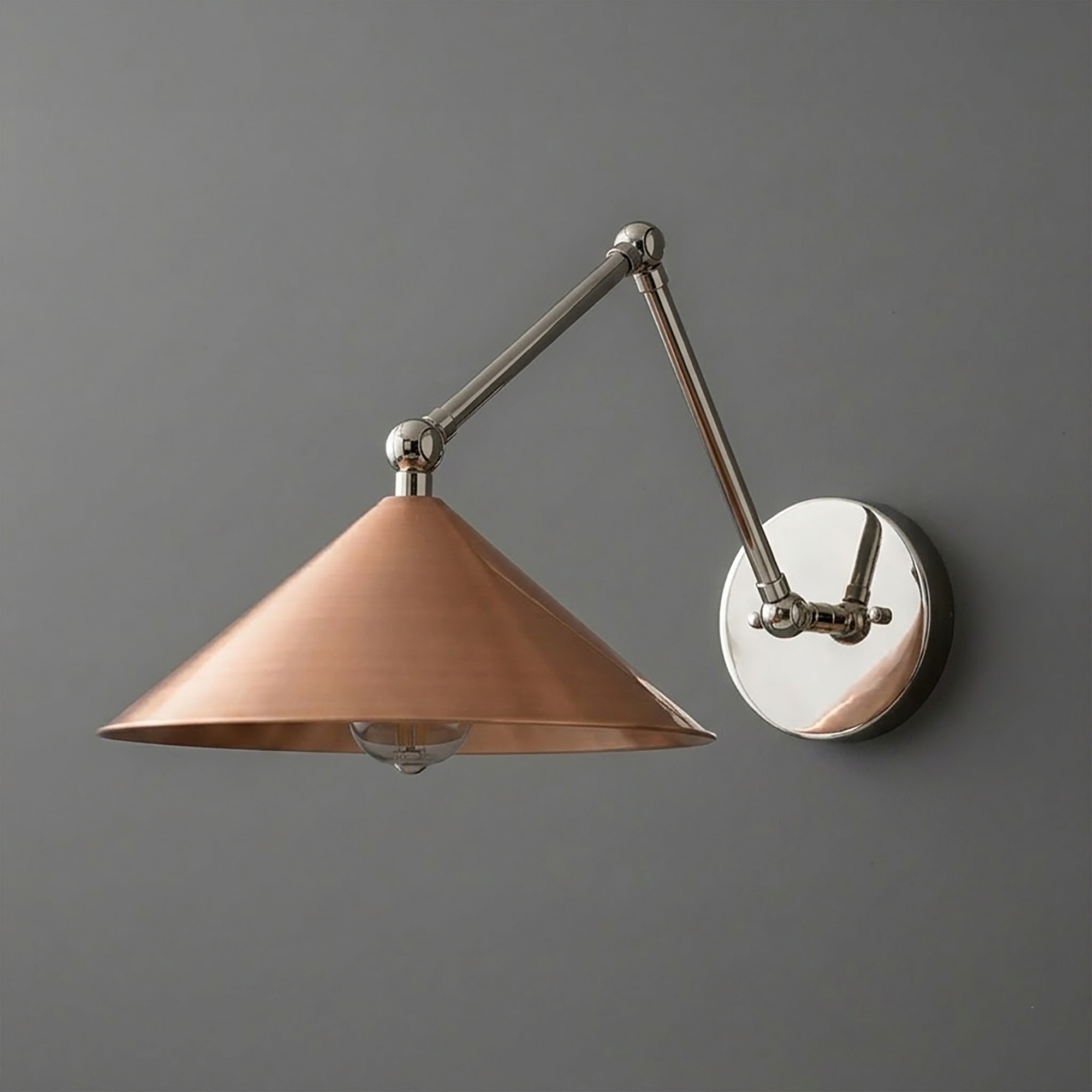 Wall-mounted sconce with adjustable polished metal arm and conical copper shade. - SCONCE MODEL NO. 6414