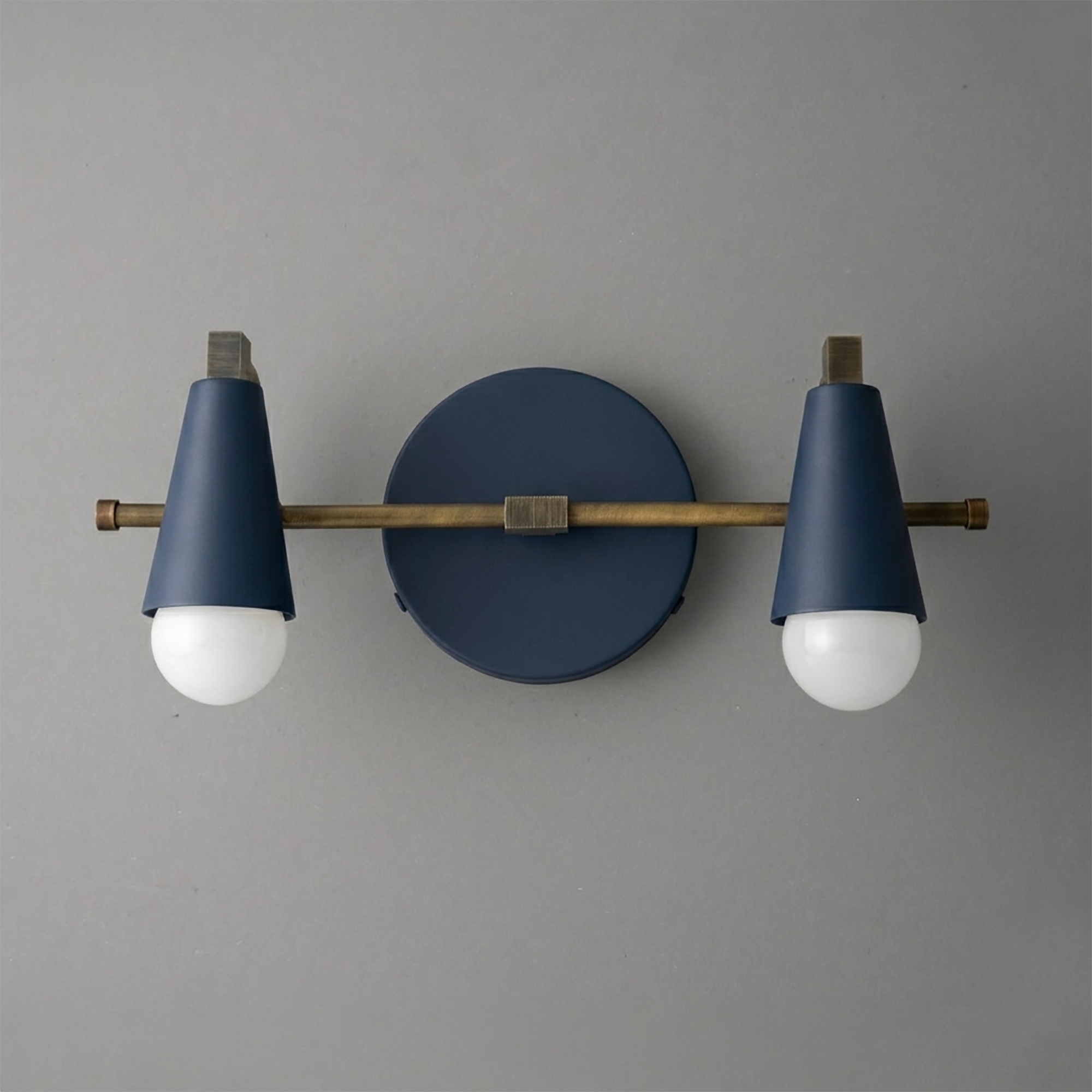 Scandinavian style vanity light with two matte blue conical shades and brass horizontal bar mounting. - VANITY LIGHT MODEL NO. 1229