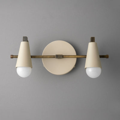 Scandinavian-style vanity light with two white conical shades and exposed round bulbs on a matte beige circular base with. - VANITY LIGHT MODEL NO. 1229