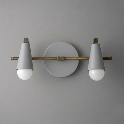 Scandinavian style vanity light with white cone shades, two exposed bulbs, brass horizontal rod, and round white wall mount. - VANITY LIGHT MODEL NO. 1229