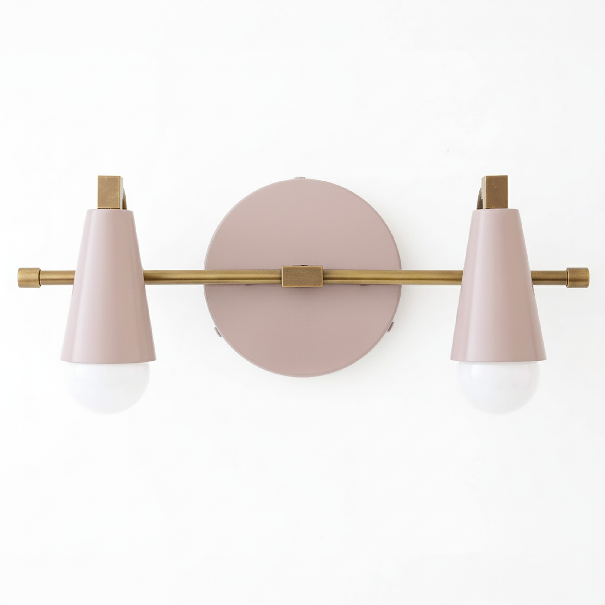 Industrial-style vanity light with two conical pink metal shades and brass accents on a round pink wall plate. - VANITY LIGHT MODEL NO. 1229