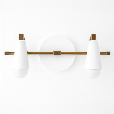Two-bulb vanity light with white conical shades and antique brass horizontal rod and round white backplate. - VANITY LIGHT MODEL NO. 1229