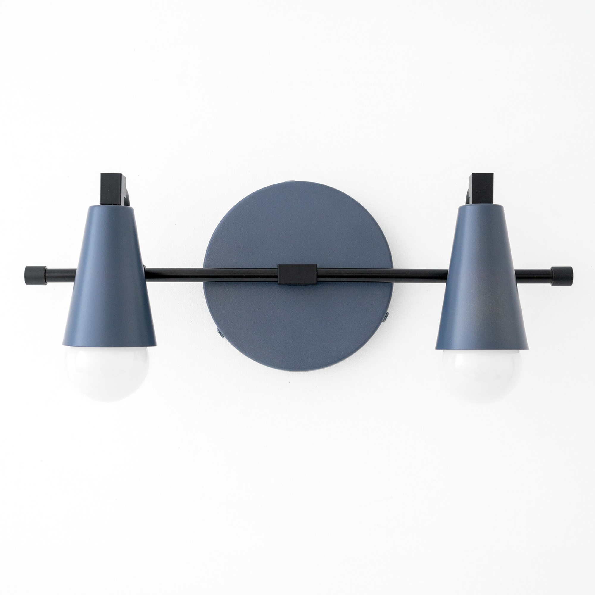 Matte blue Scandinavian-style vanity light with two conical shades and exposed bulbs on black horizontal bar. - VANITY LIGHT MODEL NO. 1229