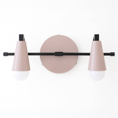 Scandinavian-style vanity light with two bare bulbs, matte pink metal shades, and black horizontal bar. - VANITY LIGHT MODEL NO. 1229
