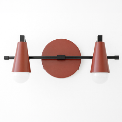 Scandinavian-style wall vanity light with two matte rust-colored cone shades and black metal accents. - VANITY LIGHT MODEL NO. 1229