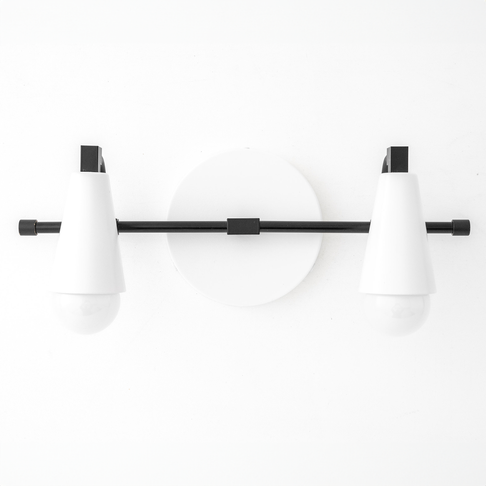 Industrial style vanity light with two white conical shades and black metal bar mount. - VANITY LIGHT MODEL NO. 1229