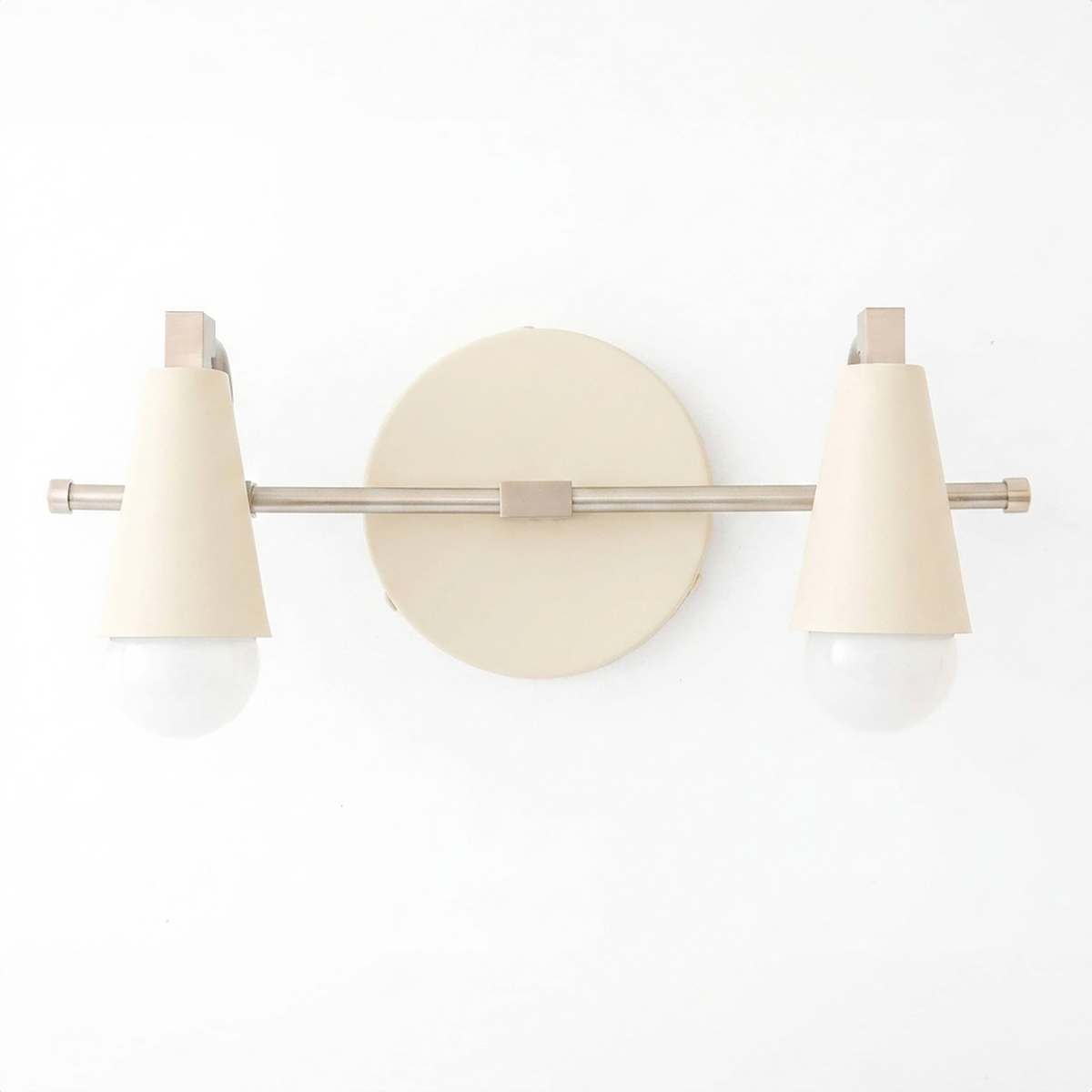 Cream-colored Scandinavian-style vanity light with two conical shades and exposed bulbs on horizontal metal rod. - VANITY LIGHT MODEL NO. 1229