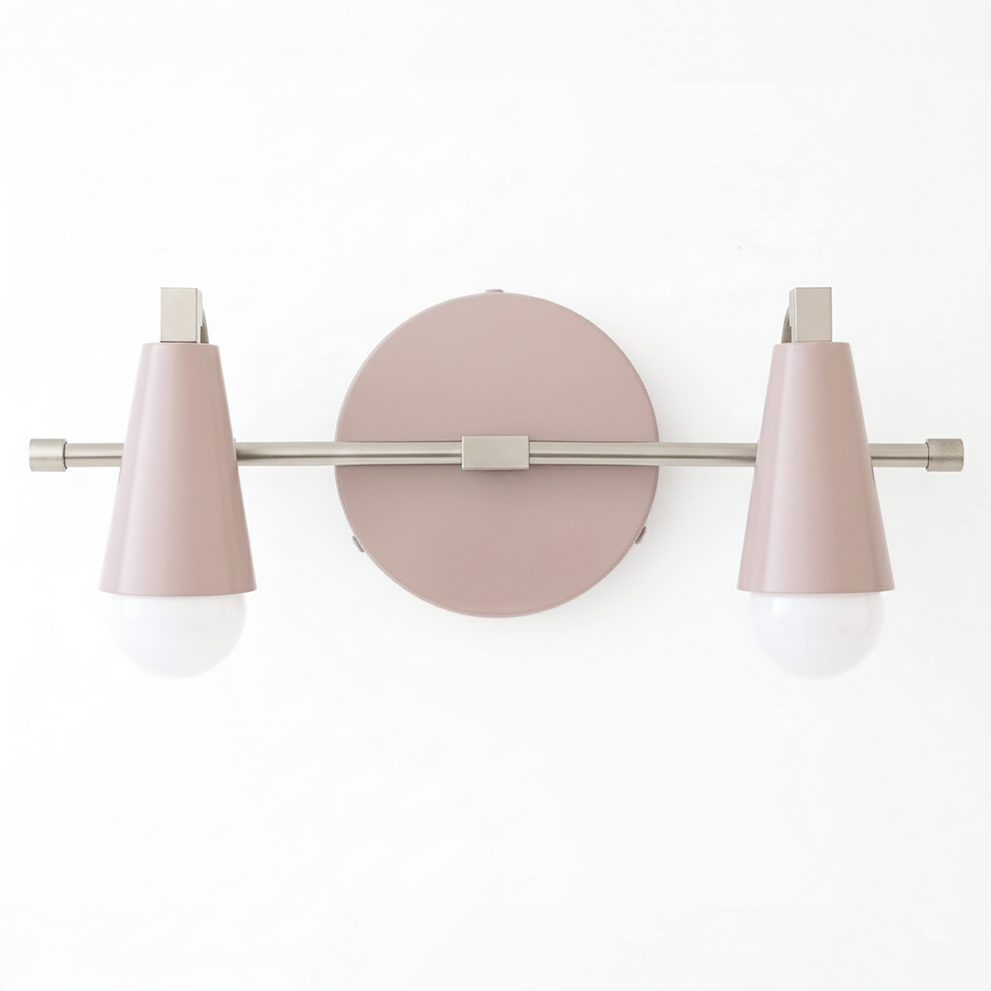 Industrial-style vanity light with two pink metal cone-shaped shades and exposed white bulbs on a brushed nickel bar and. - VANITY LIGHT MODEL NO. 1229