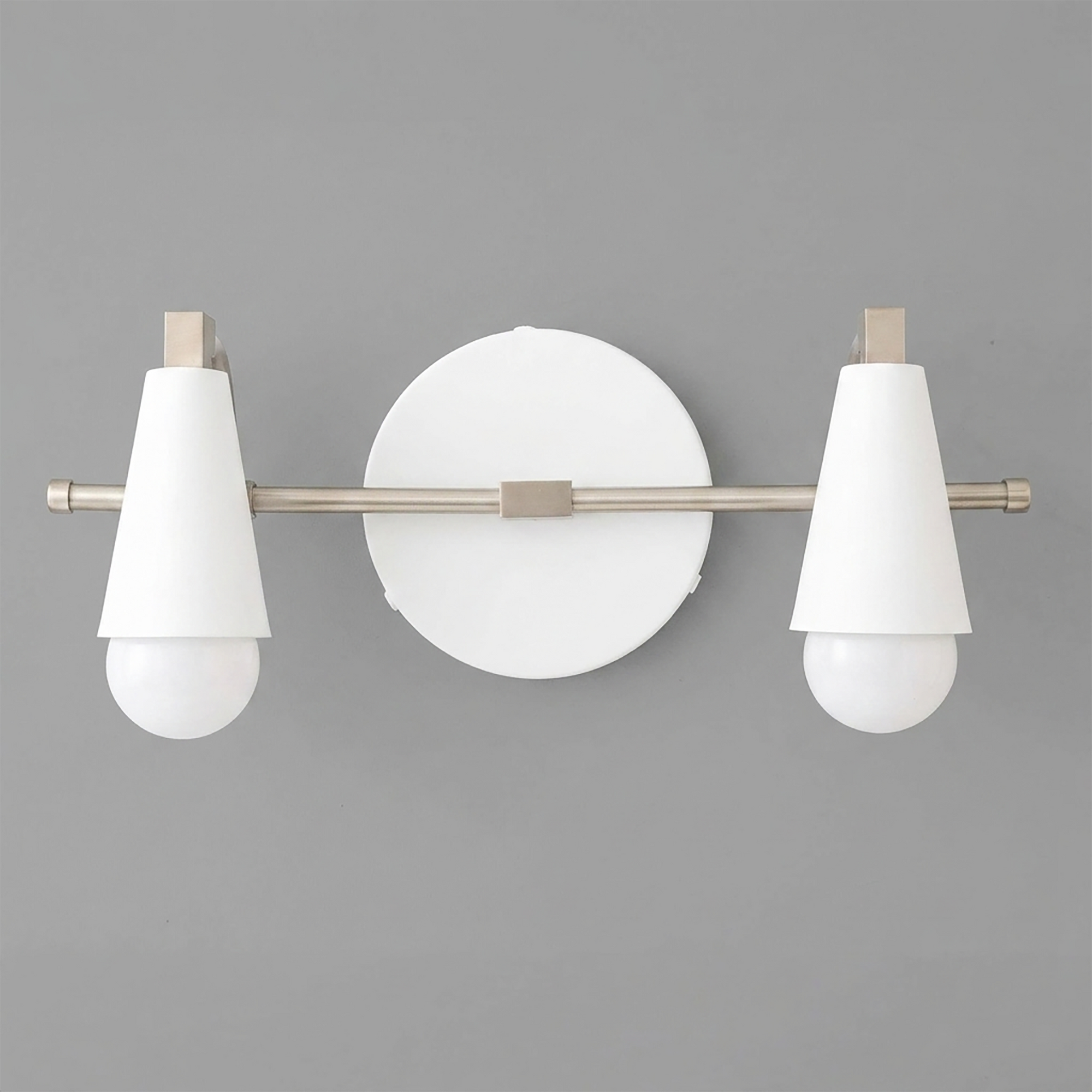 Scandinavian-style two-bulb vanity light with white conical shades and brushed metal accents on gray background. - VANITY LIGHT MODEL NO. 1229