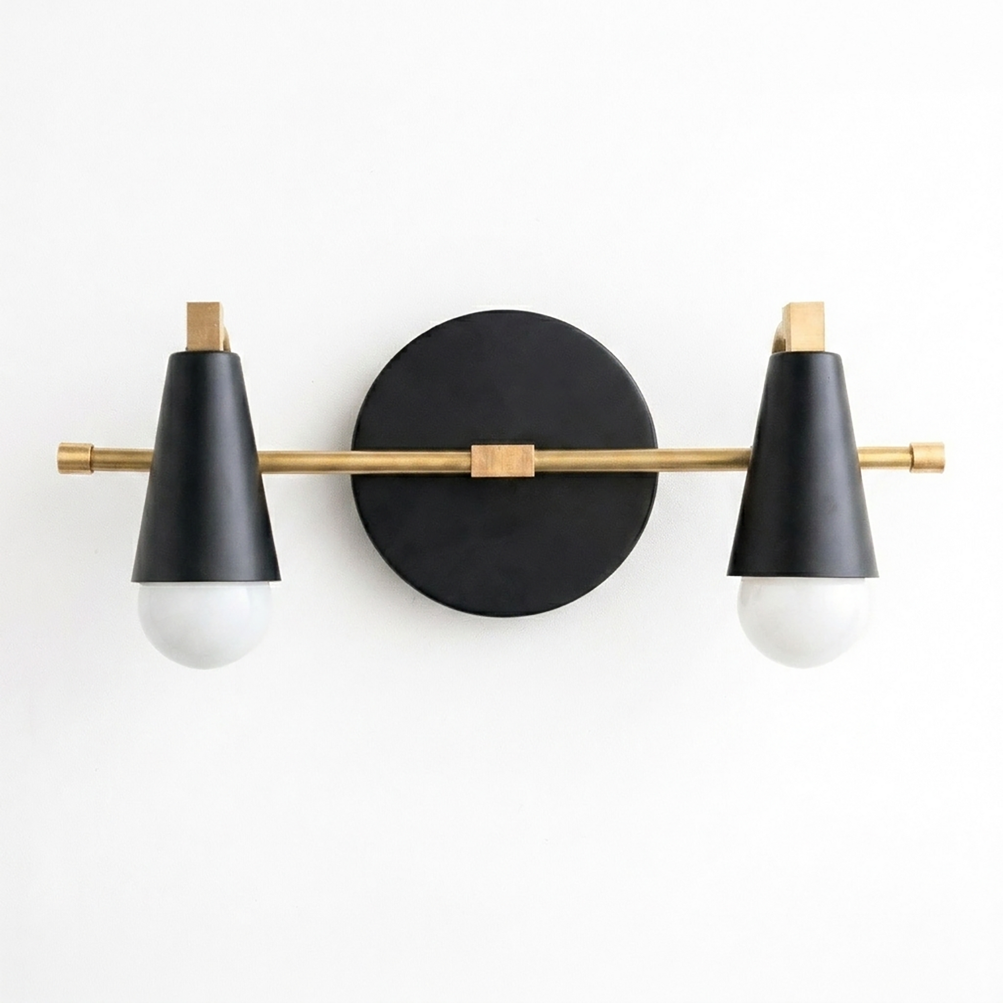 Scandinavian-style two-bulb vanity light with matte black conical shades and brass accents on a round black base. - VANITY LIGHT MODEL NO. 1229