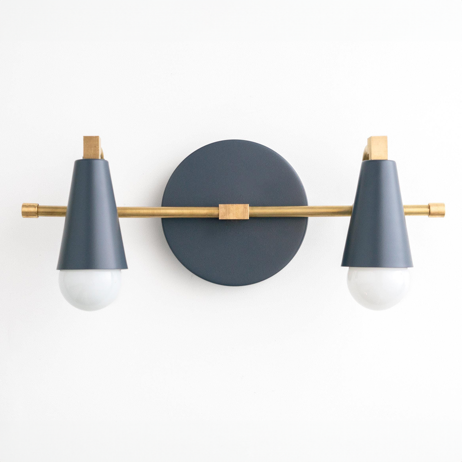 Industrial-style vanity light with matte black cone shades and brass accents, two exposed bulbs. - VANITY LIGHT MODEL NO. 1229