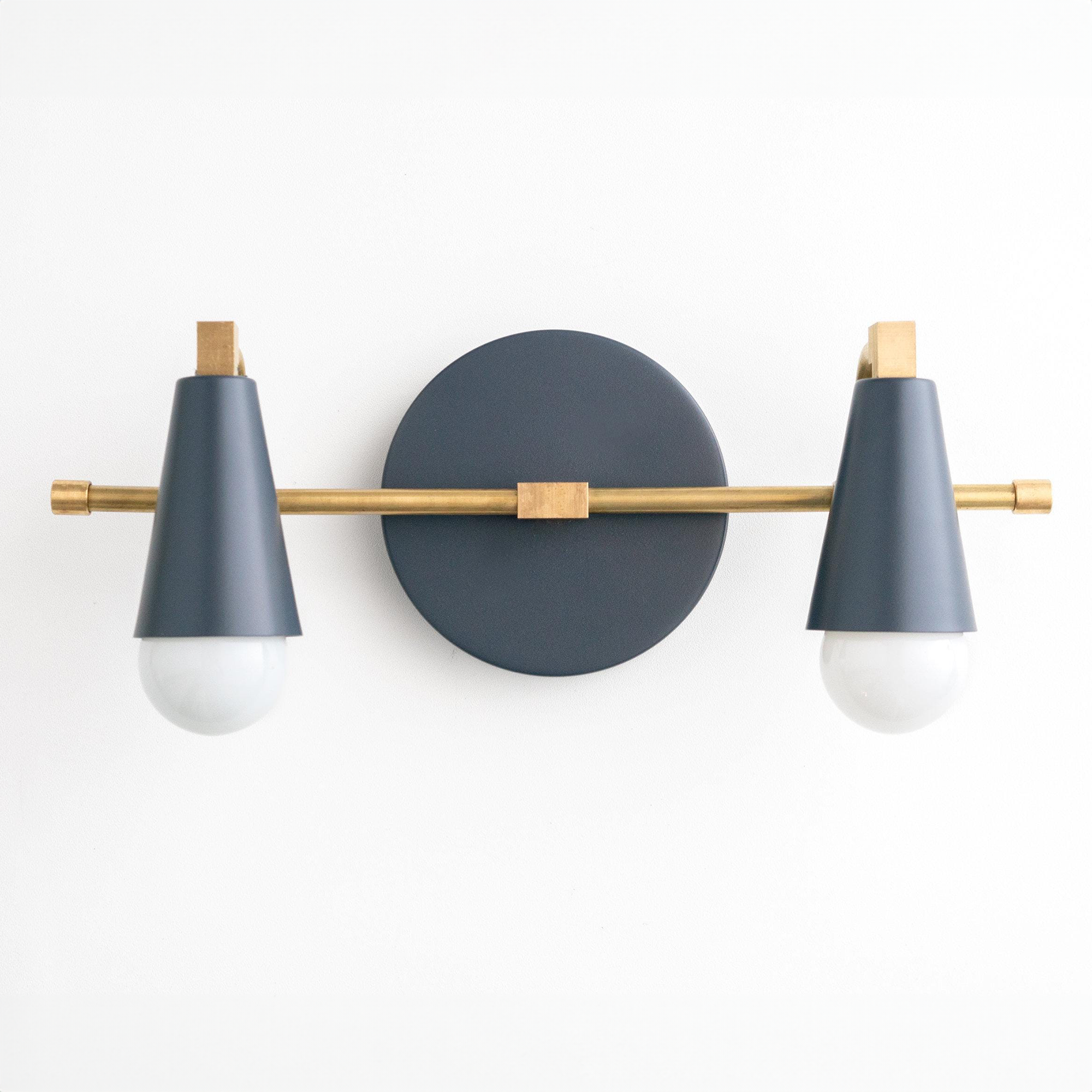 Industrial-style vanity light with matte black cone shades and brass accents, two exposed bulbs. - VANITY LIGHT MODEL NO. 1229