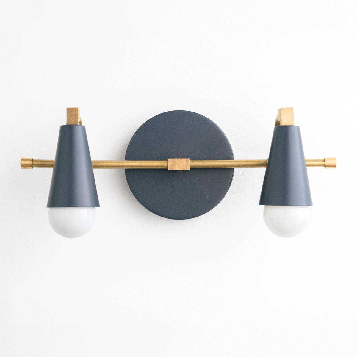 Two-bulb Scandinavian-style vanity light with matte black conical shades and brass accents. - VANITY LIGHT MODEL NO. 1229