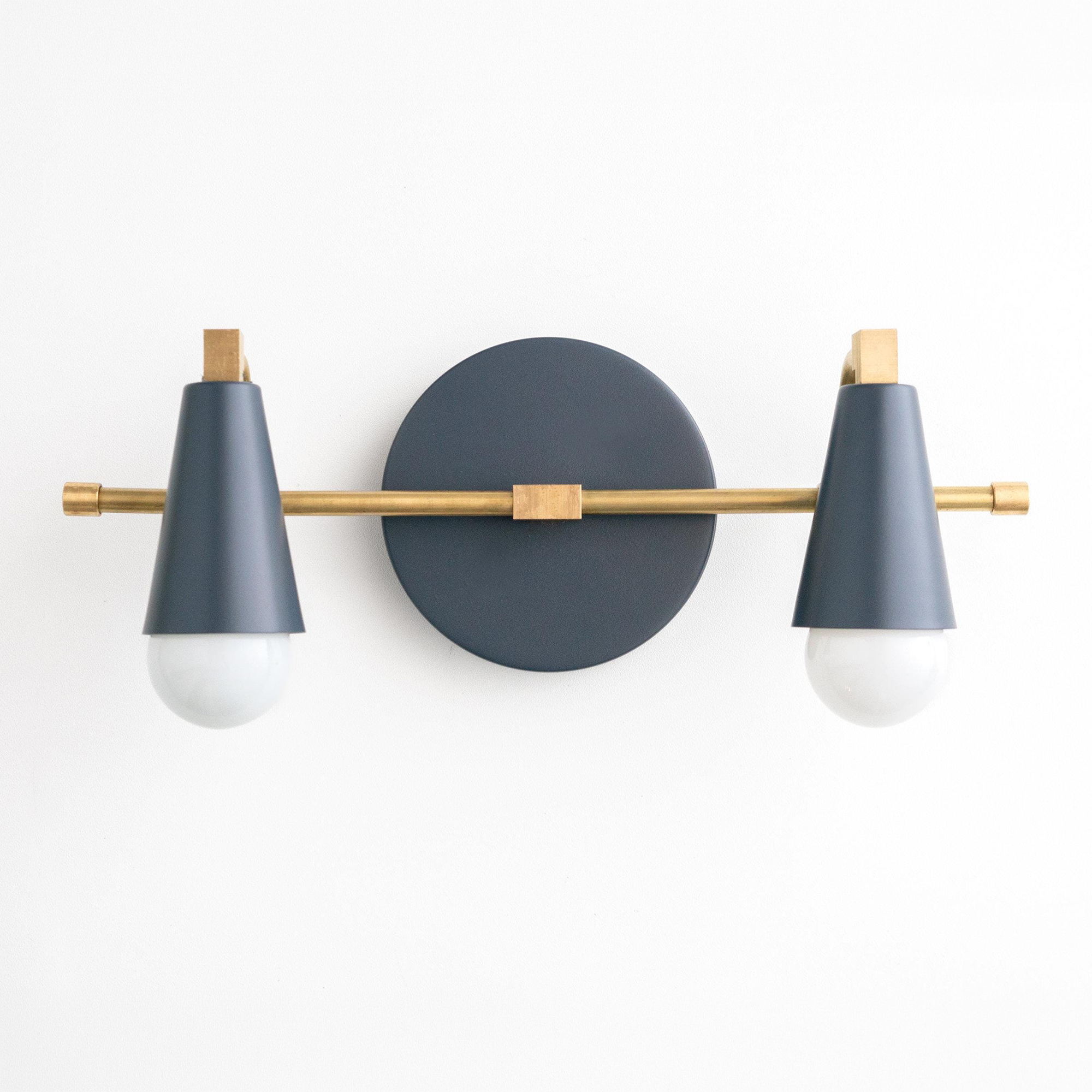 Two-bulb Scandinavian-style vanity light with matte black conical shades and brass accents. - VANITY LIGHT MODEL NO. 1229