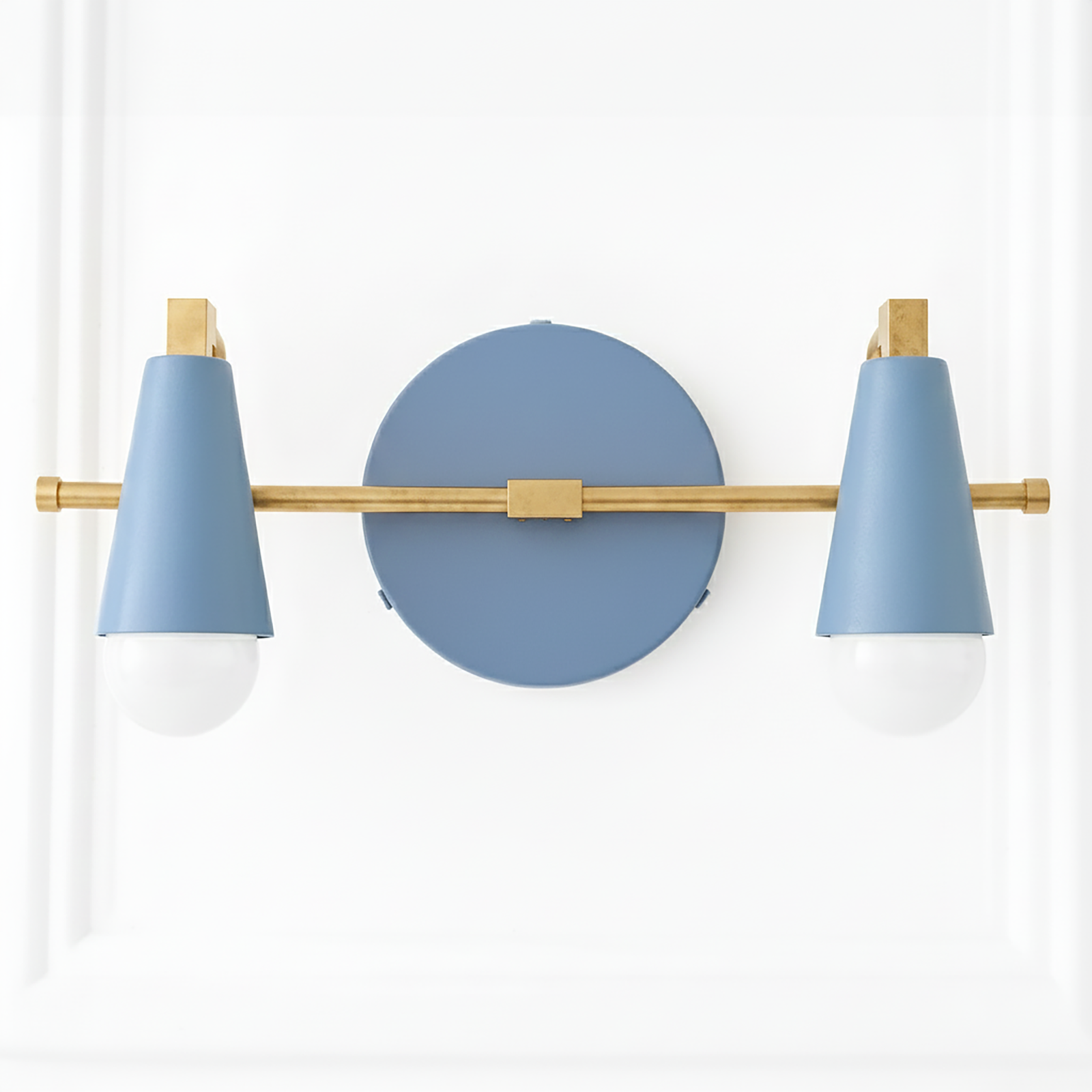 Two-light vanity fixture with matte blue cone shades and brass horizontal bar on a round blue wall plate. - VANITY LIGHT MODEL NO. 1229