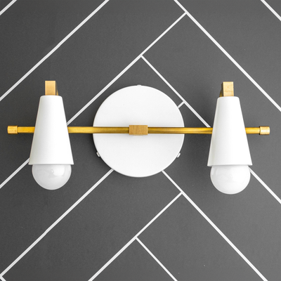 Scandinavian style 2-bulb vanity light with white cone shades and brass accents on round white base. - VANITY LIGHT MODEL NO. 1229