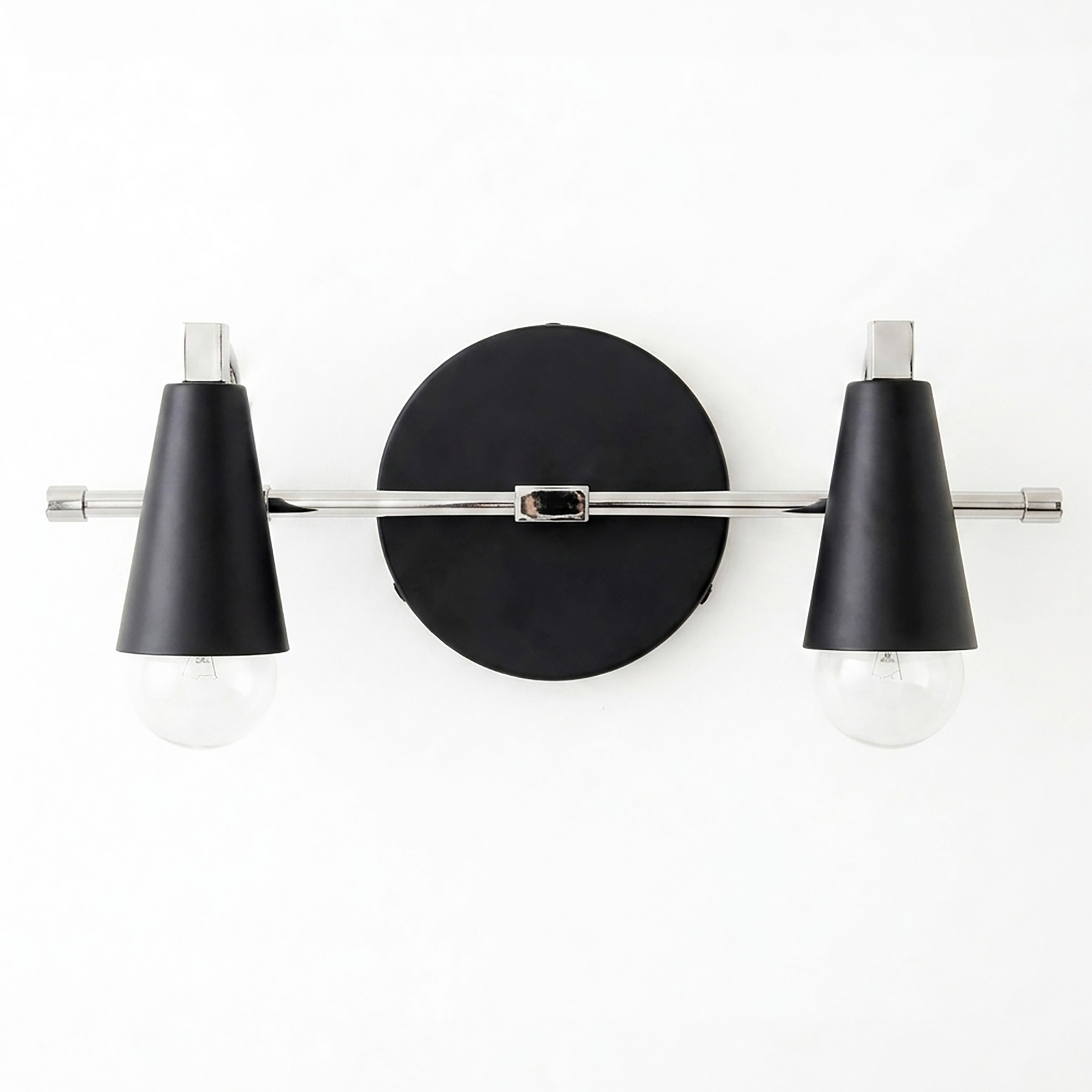 Two-bulb vanity light with black conical shades and chrome horizontal rod mounted on round black base. - VANITY LIGHT MODEL NO. 1229