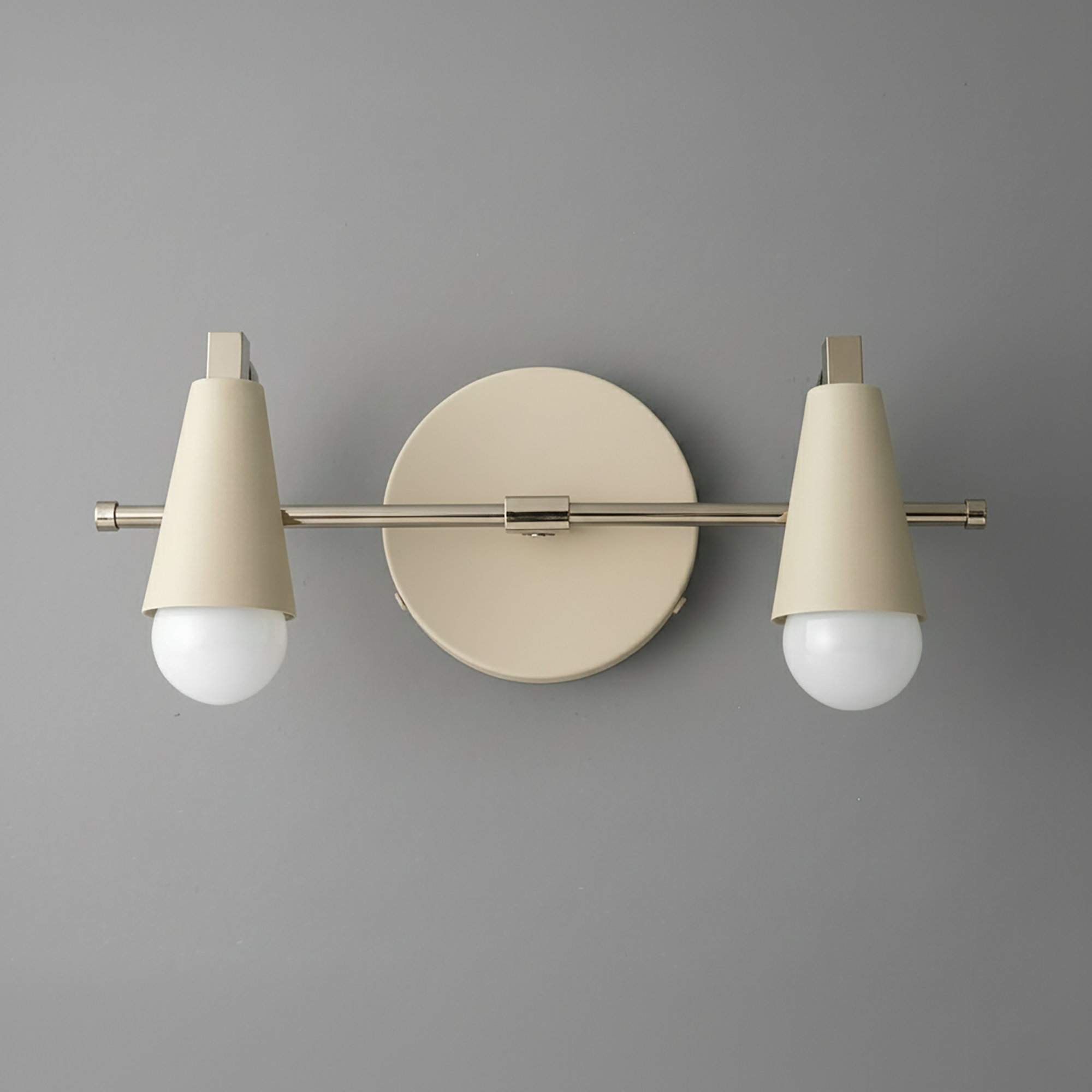 Matte beige industrial vanity light with two conical shades and exposed round bulbs on a circular backplate. - VANITY LIGHT MODEL NO. 1229