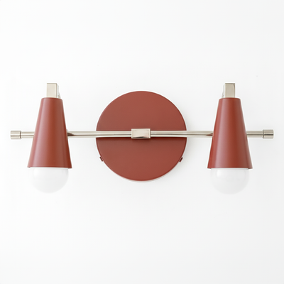 Industrial-style vanity light with two bare bulbs, rust-colored conical shades, and brushed metal accents. - VANITY LIGHT MODEL NO. 1229