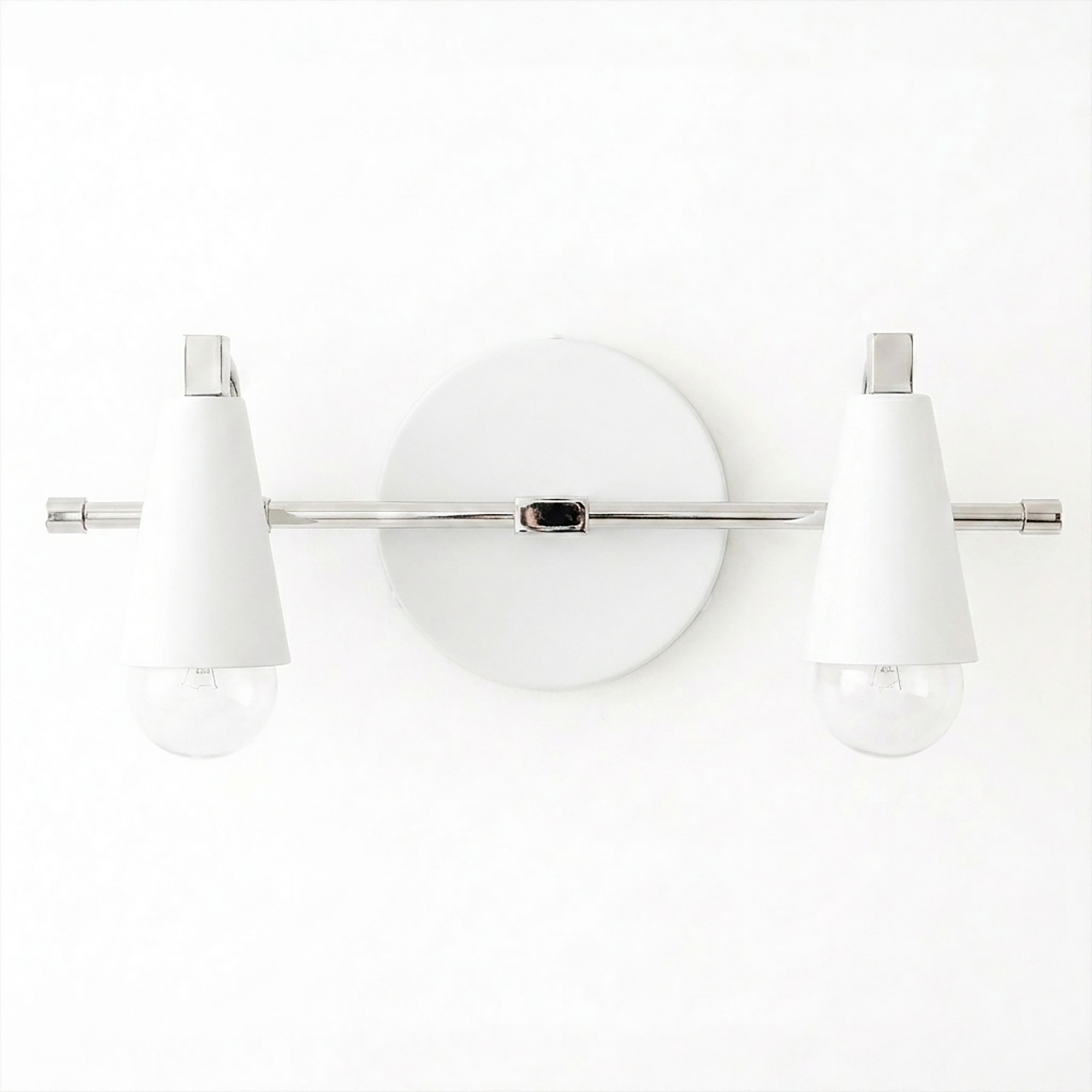 Scandinavian-style 2-bulb vanity light with white cone-shaped shades and chrome metal bar mounting on round wall plate. - VANITY LIGHT MODEL NO. 1229