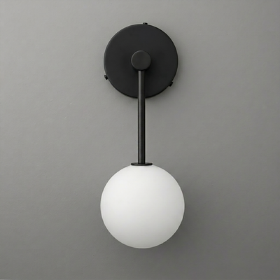 Black metal wall sconce with matte finish and single frosted white glass globe light shade. - Sconce Model No. 5999