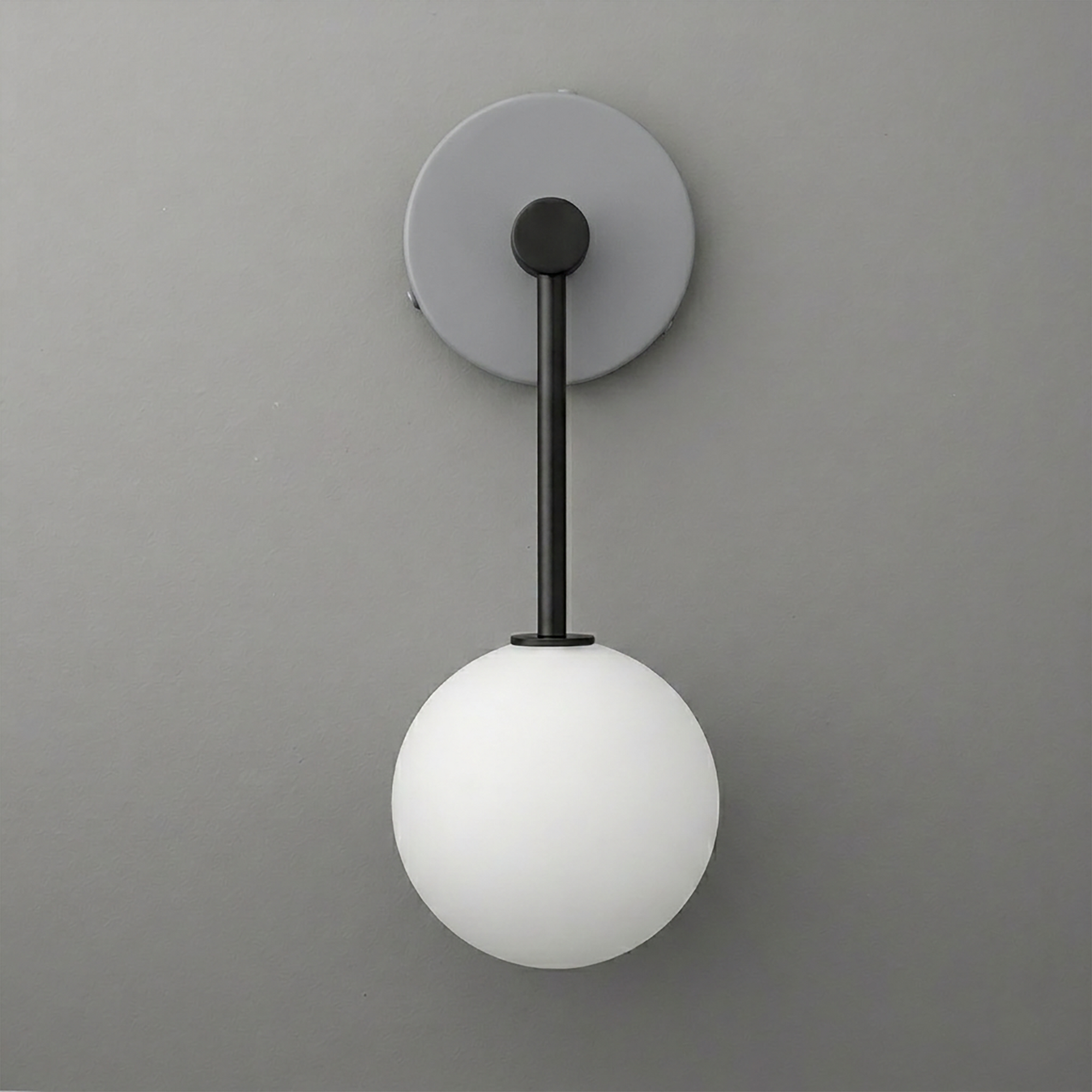Wall sconce with matte black metal rod and round white frosted glass globe shade. - Sconce Model No. 5999