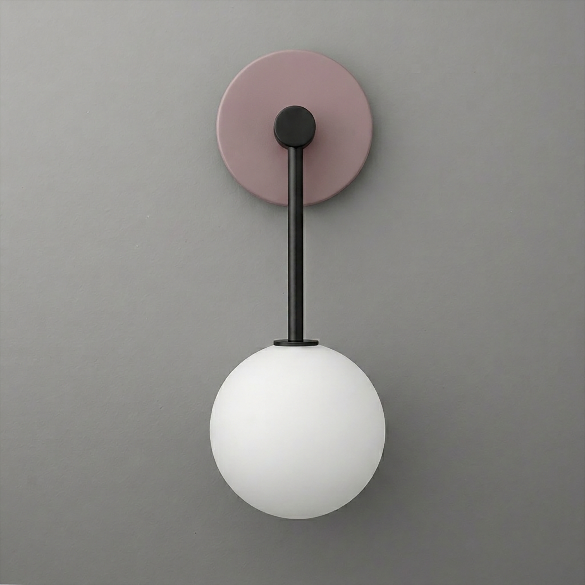 Wall sconce with a matte black arm, muted lavender round backplate, and frosted white glass globe shade. - Sconce Model No. 5999
