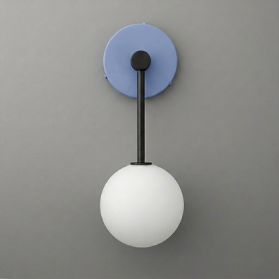 Black metal wall sconce with a round blue backplate and a white frosted glass globe shade. - Sconce Model No. 5999