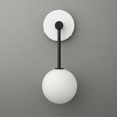 Wall sconce with matte black metal arm and mount, featuring a round white frosted glass globe shade. - Sconce Model No. 5999