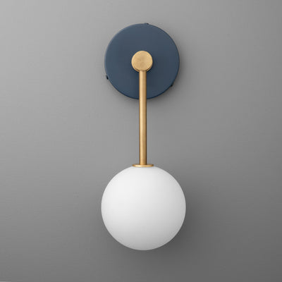 Wall sconce with matte black round base, brass rod, and white frosted glass globe shade. - Sconce Model No. 5999