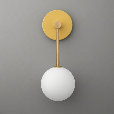 Matte gold wall sconce with a round backplate and white frosted glass globe shade. - Sconce Model No. 5999