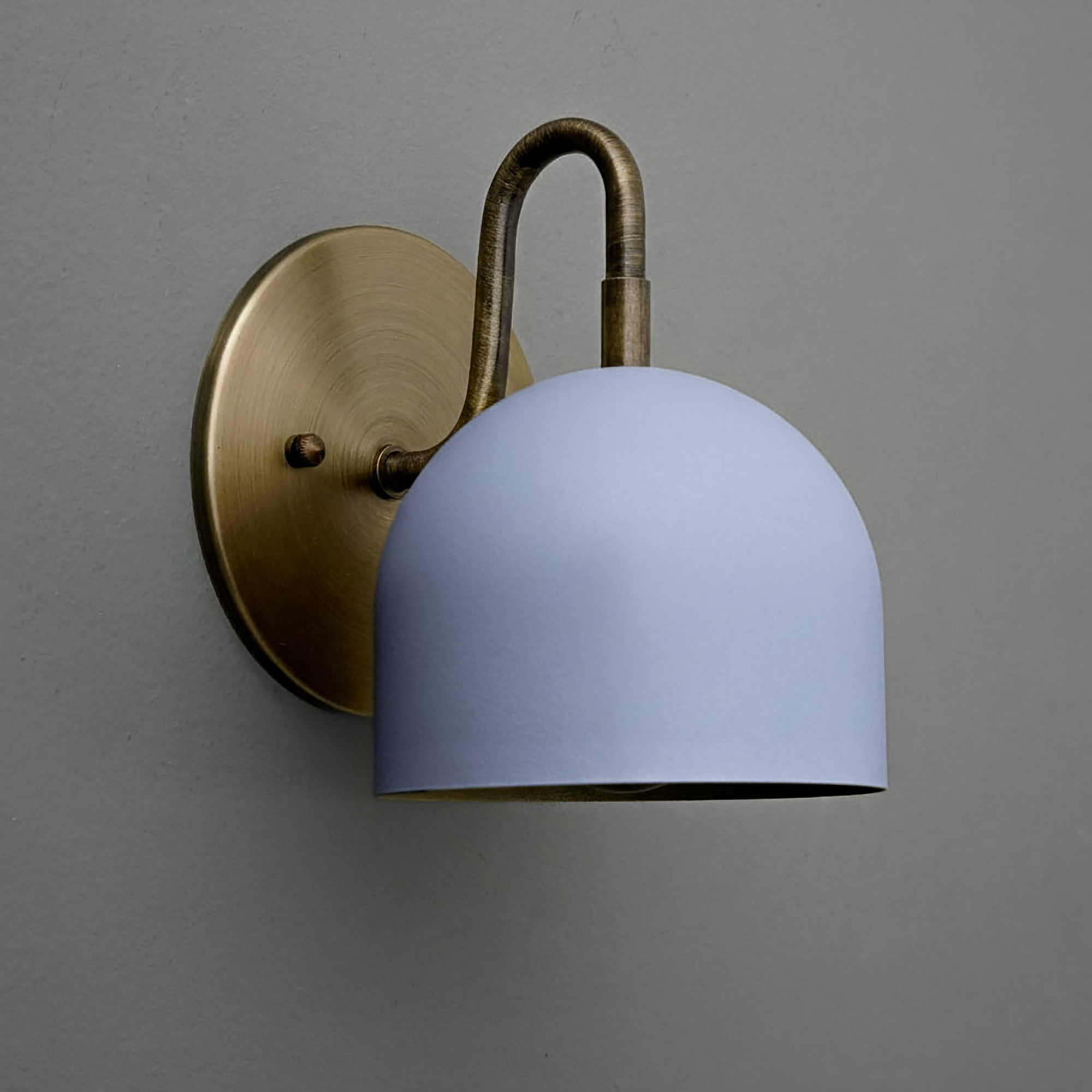 Wall sconce with matte blue dome shade and antique brass curved arm and round backplate. - Sconce Model No. 5416