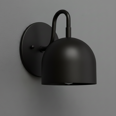 Matte black metal wall sconce with dome-shaped shade and curved arm mounting on round backplate. - Sconce Model No. 5416