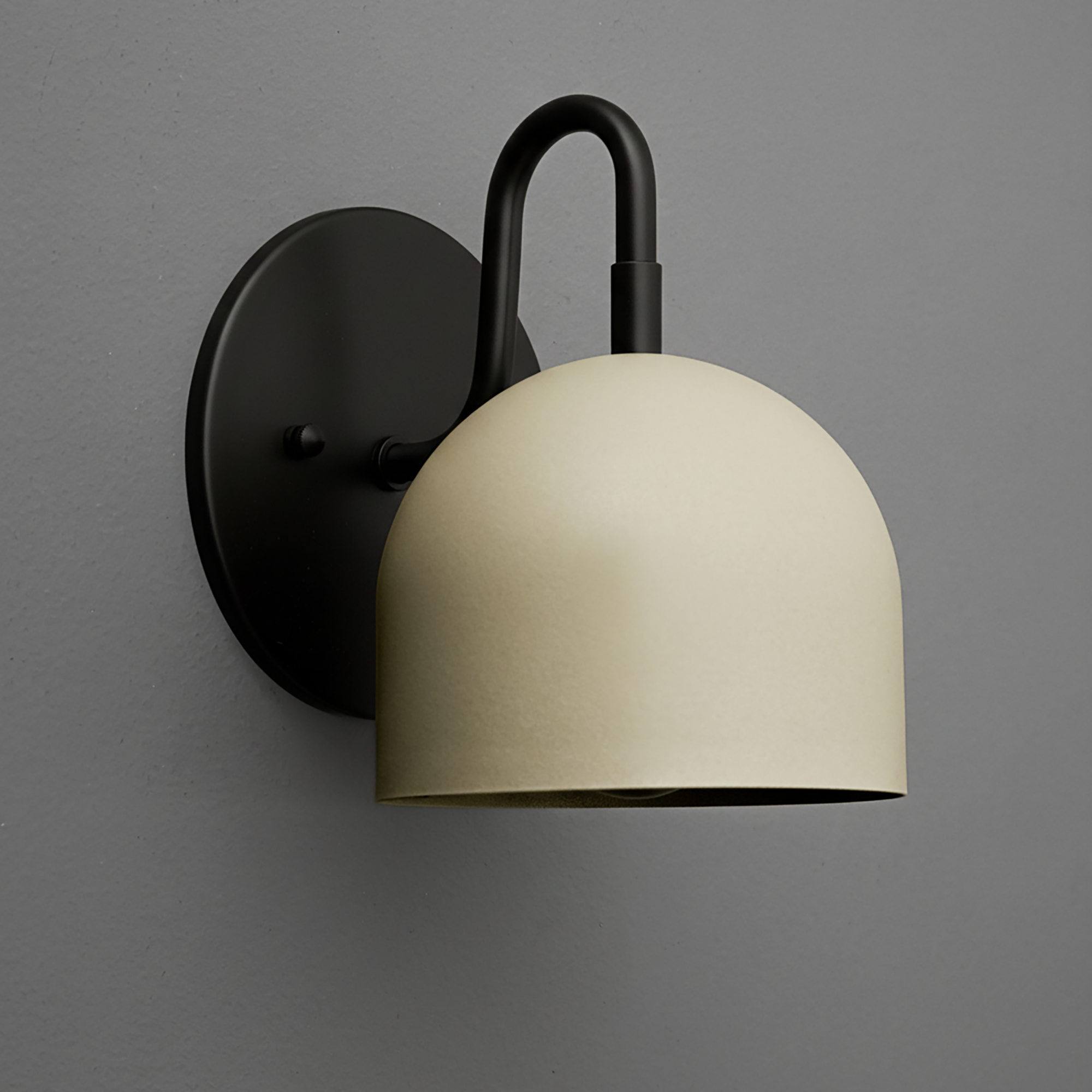 Black metal wall sconce with matte cream dome-shaped shade and rounded backplate. - Sconce Model No. 5416