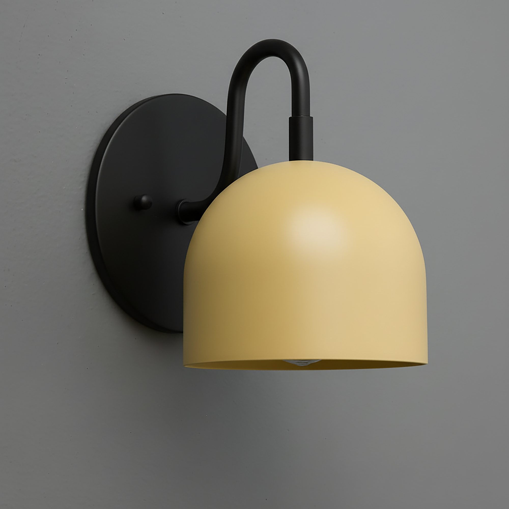 Matte black metal wall sconce with curved arm and mustard yellow dome-shaped shade. - Sconce Model No. 5416