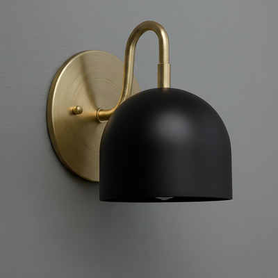 Matte black dome-shaped metal shade sconce with brushed brass round wall mount and curved arm. - Sconce Model No. 5416