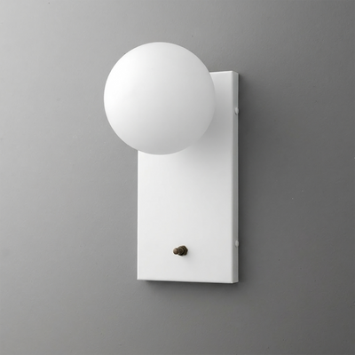 White rectangular metal backplate sconce with matte white globe-shaped bulb cover and small brass toggle switch. - Sconce Model No. 2196