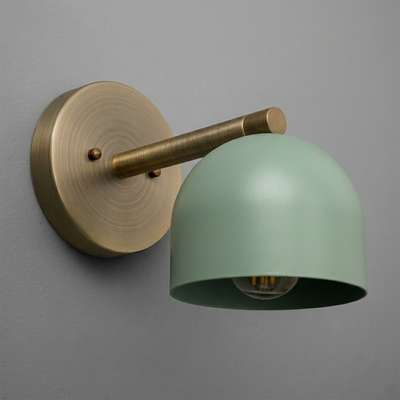 Wall-mounted sconce with matte brass arm and round base, featuring a smooth seafoam green dome shade. - Sconce Model No. 5356
