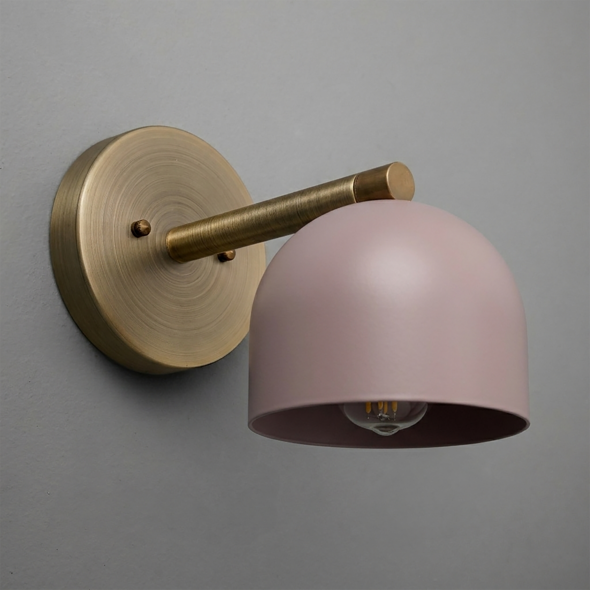 Brushed brass wall sconce with round base and matte pink dome-shaped shade from Deep Ball Collection. - Sconce Model No. 5356