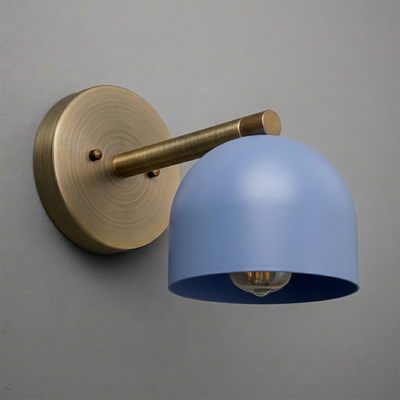 Wall sconce with brushed brass arm and base, featuring a matte blue dome-shaped metal shade and exposed bulb. - Sconce Model No. 5356